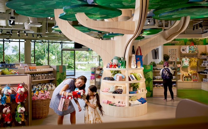 Gift shop at Bird Paradise, Singapore Zoo, with plush toys and souvenirs on display.