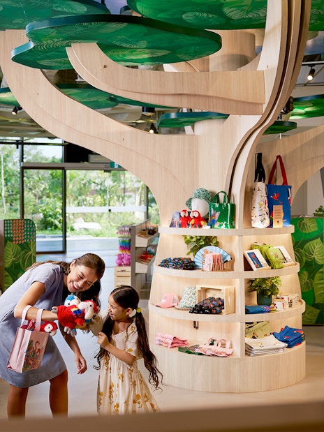 Gift shop at Bird Paradise, Singapore Zoo, with plush toys and souvenirs on display.