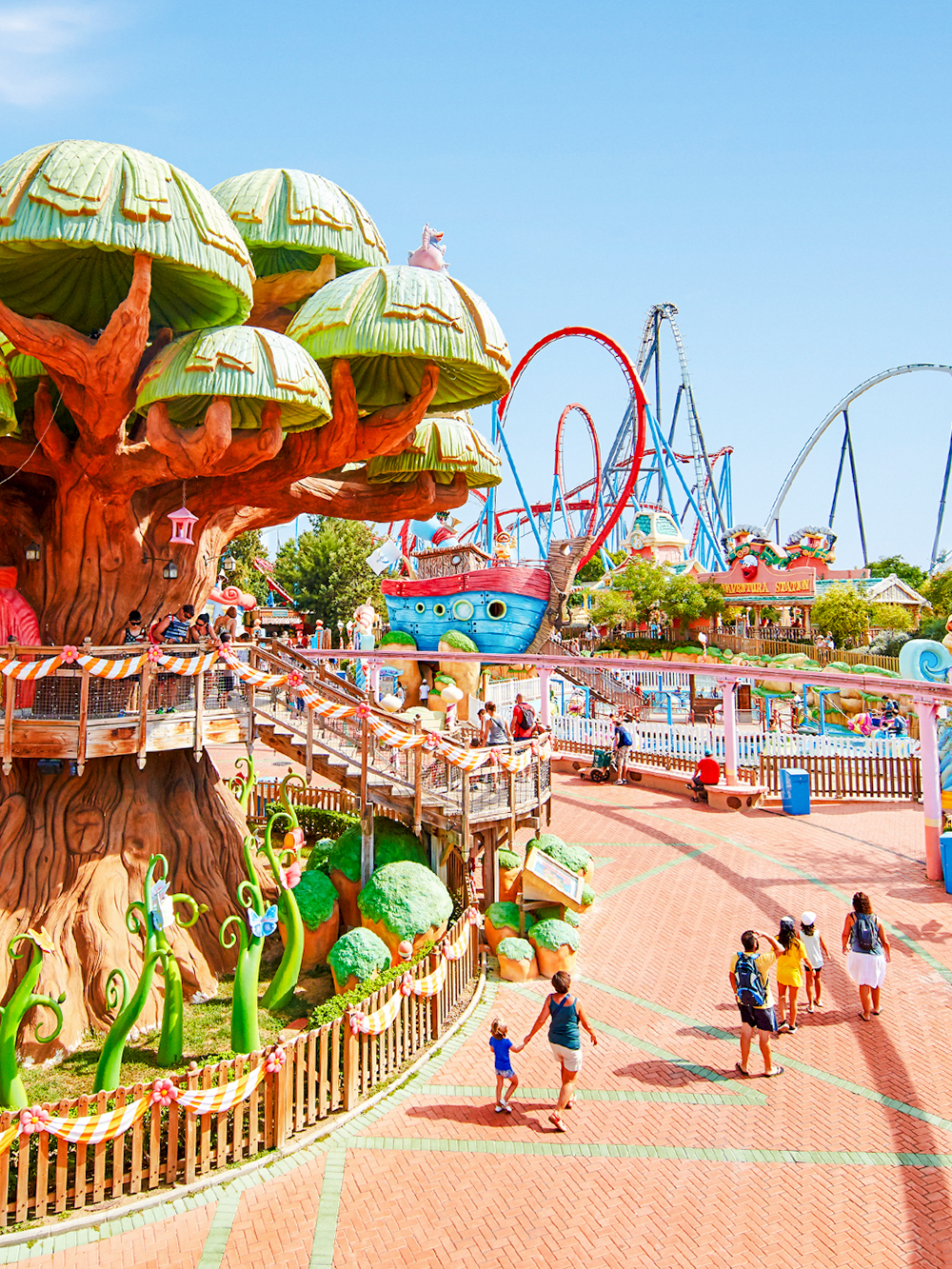 Panoramic view of PortAventura park with colorful rides and themed attractions.