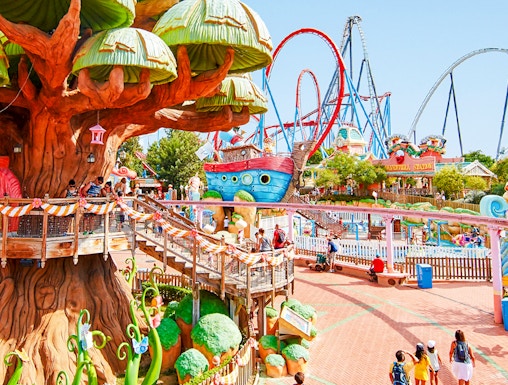 Panoramic view of PortAventura park with colorful rides and themed attractions.