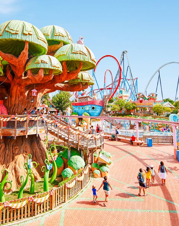 Panoramic view of PortAventura park with colorful rides and themed attractions.
