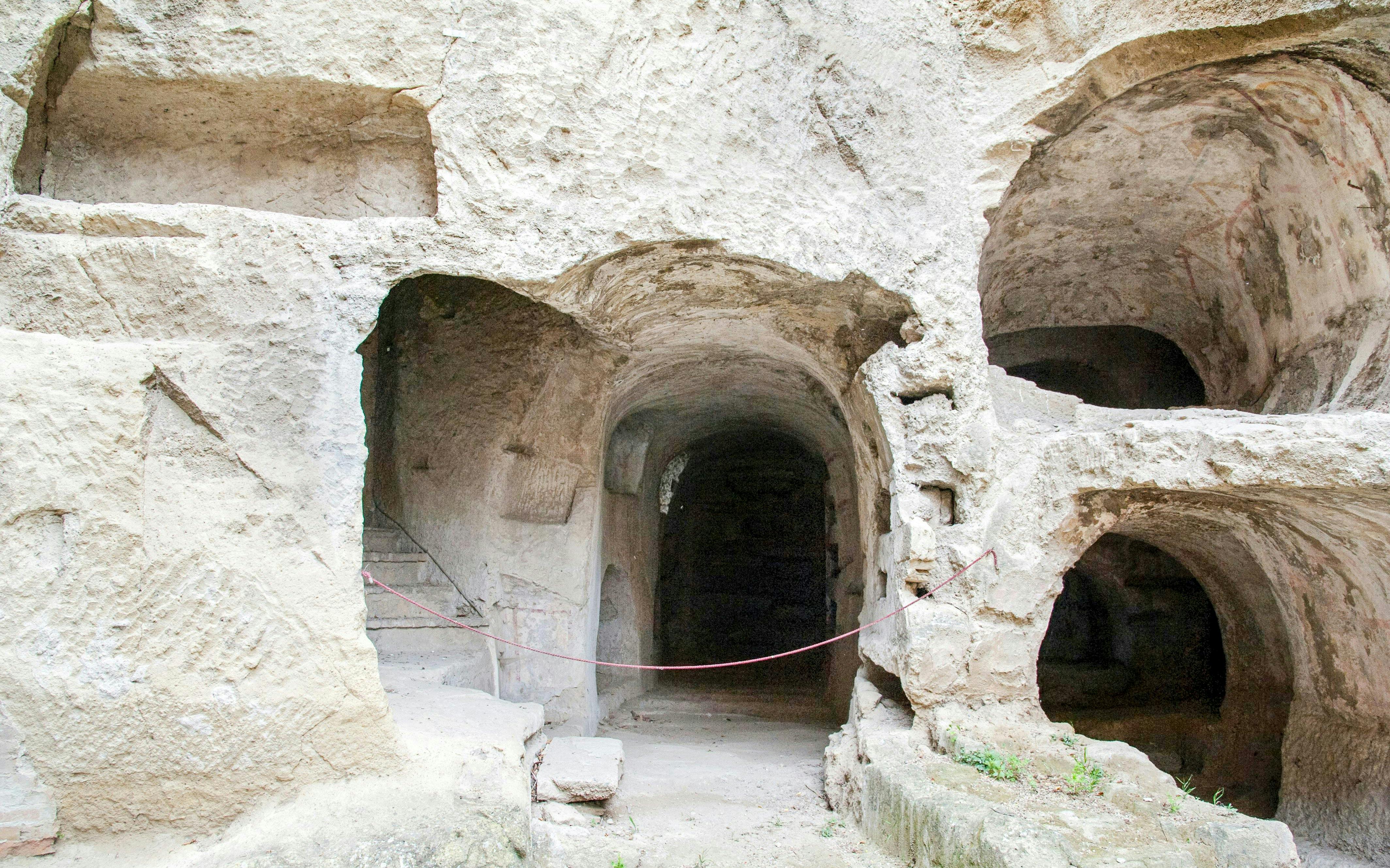 Catacombs of San Gennaro entrance with ancient stone arches and passageways in Naples.