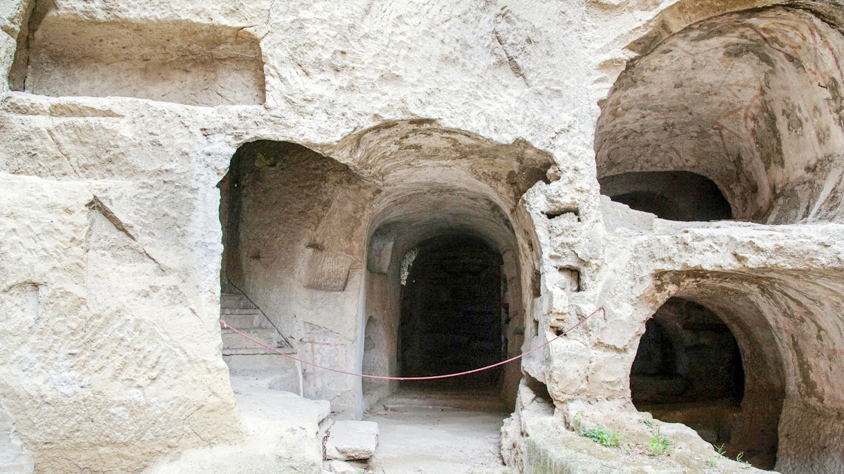Catacombs of San Gennaro entrance with ancient stone arches and passageways in Naples.