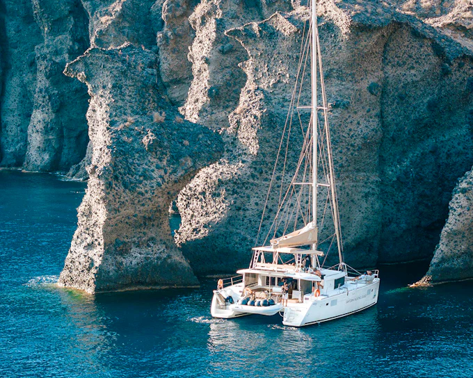 From Santorini: Luxury Catamaran Day Cruise with Lunch, Drinks & Transfers