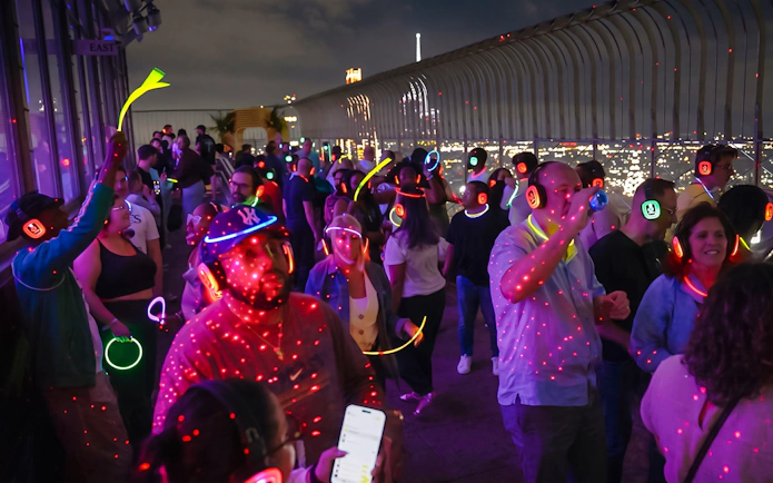 Silent disco with headphones at Empire State Building Observation Deck, New York City.