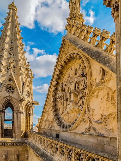 Cathedral of Majorca terrace view with intricate stone carvings and cityscape.