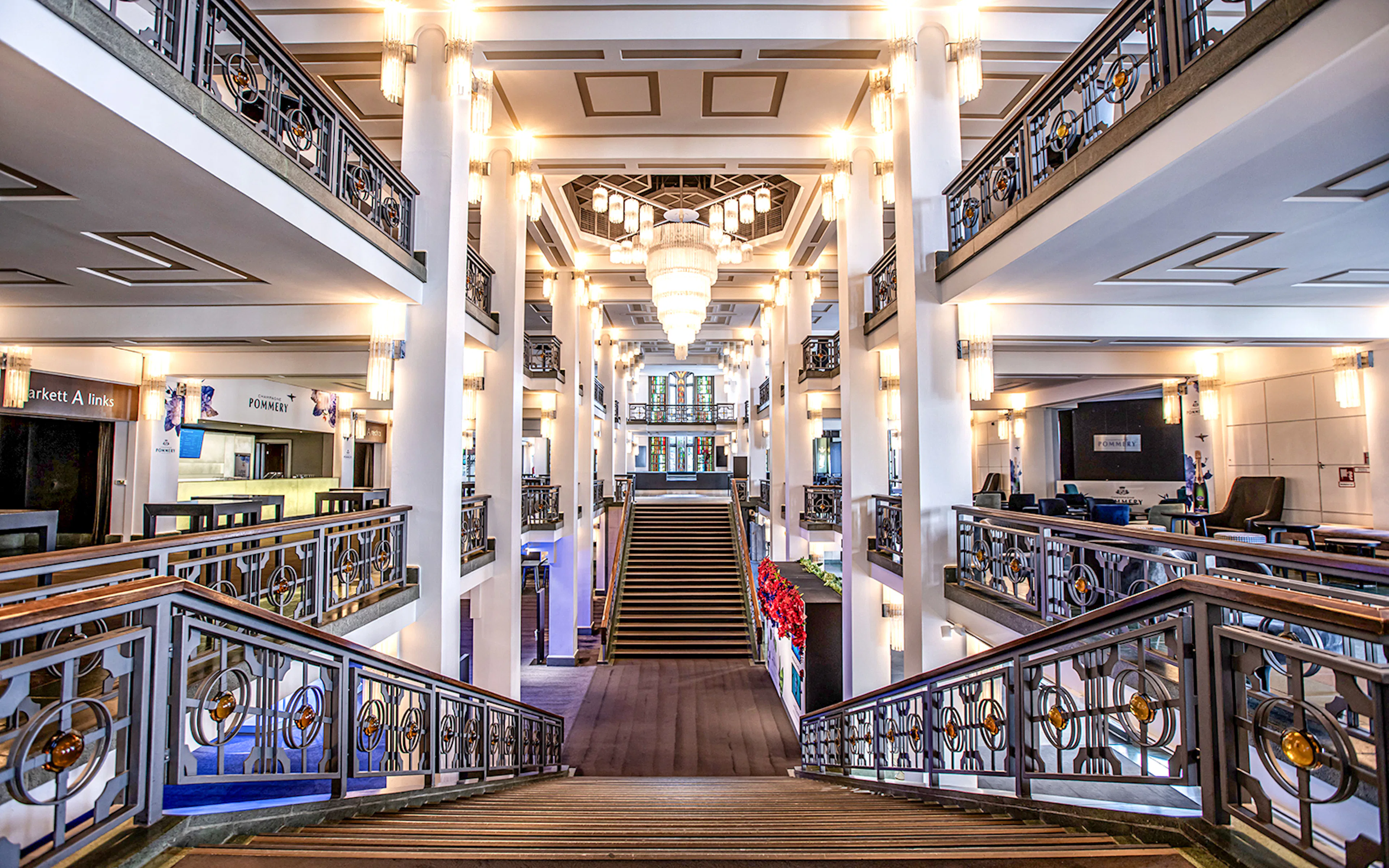 Friedrichstadt-Palast interior with grand staircase and ornate chandeliers in Berlin.