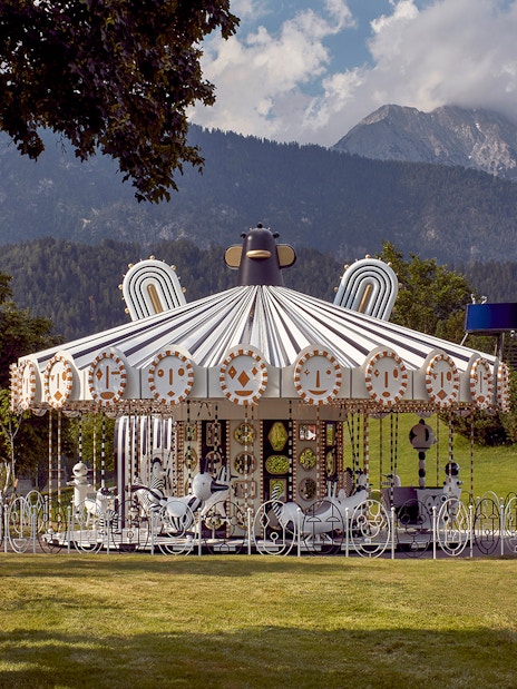 Carousel at Swarovski Crystal Worlds with mountain backdrop, Wattens, Austria.
