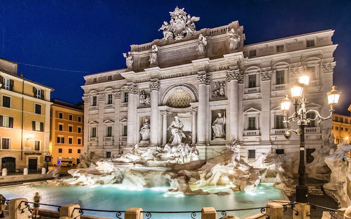 Trevi Fountain illuminated at night in Rome, Italy.