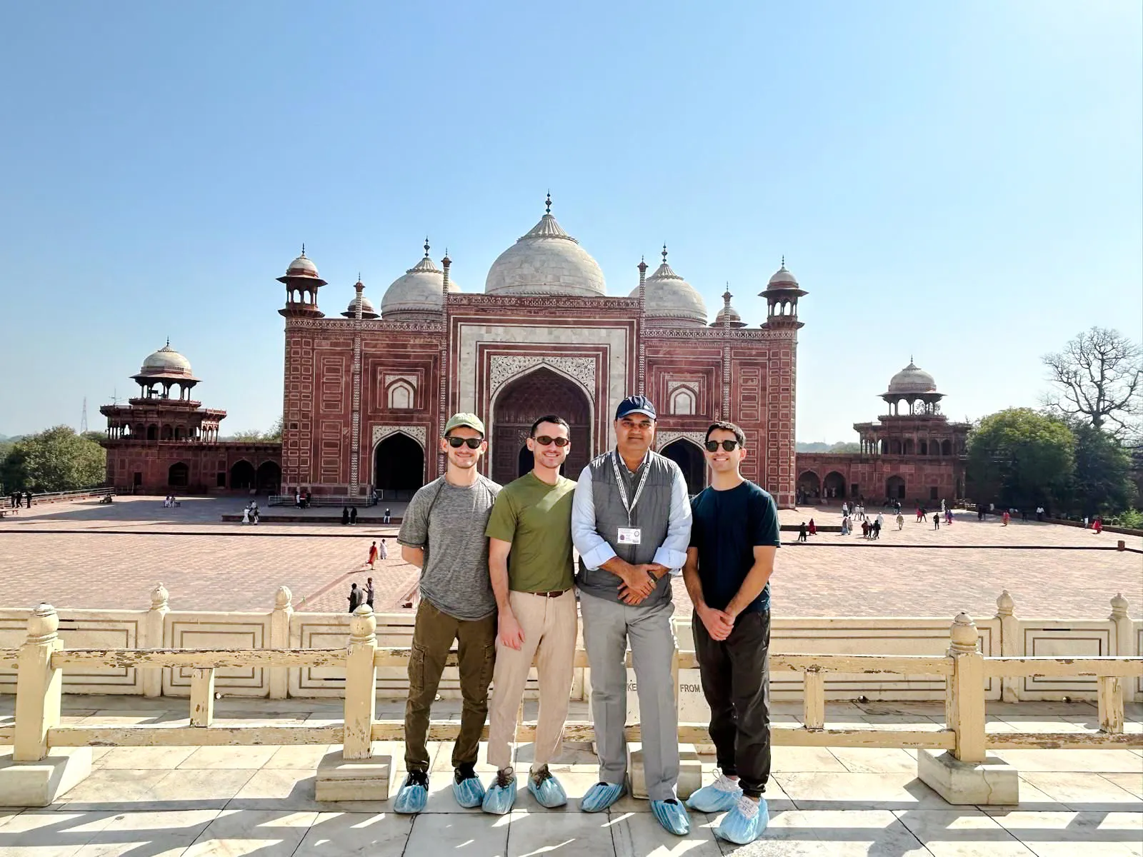 Tourists at the Taj Mahal complex in Agra during a guided tour from Delhi.