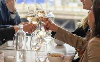 Lunch toast at Eiffel Tower's Madame Brasserie with champagne glasses.