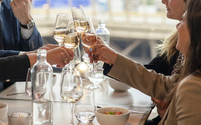 Lunch toast at Eiffel Tower's Madame Brasserie with champagne glasses.