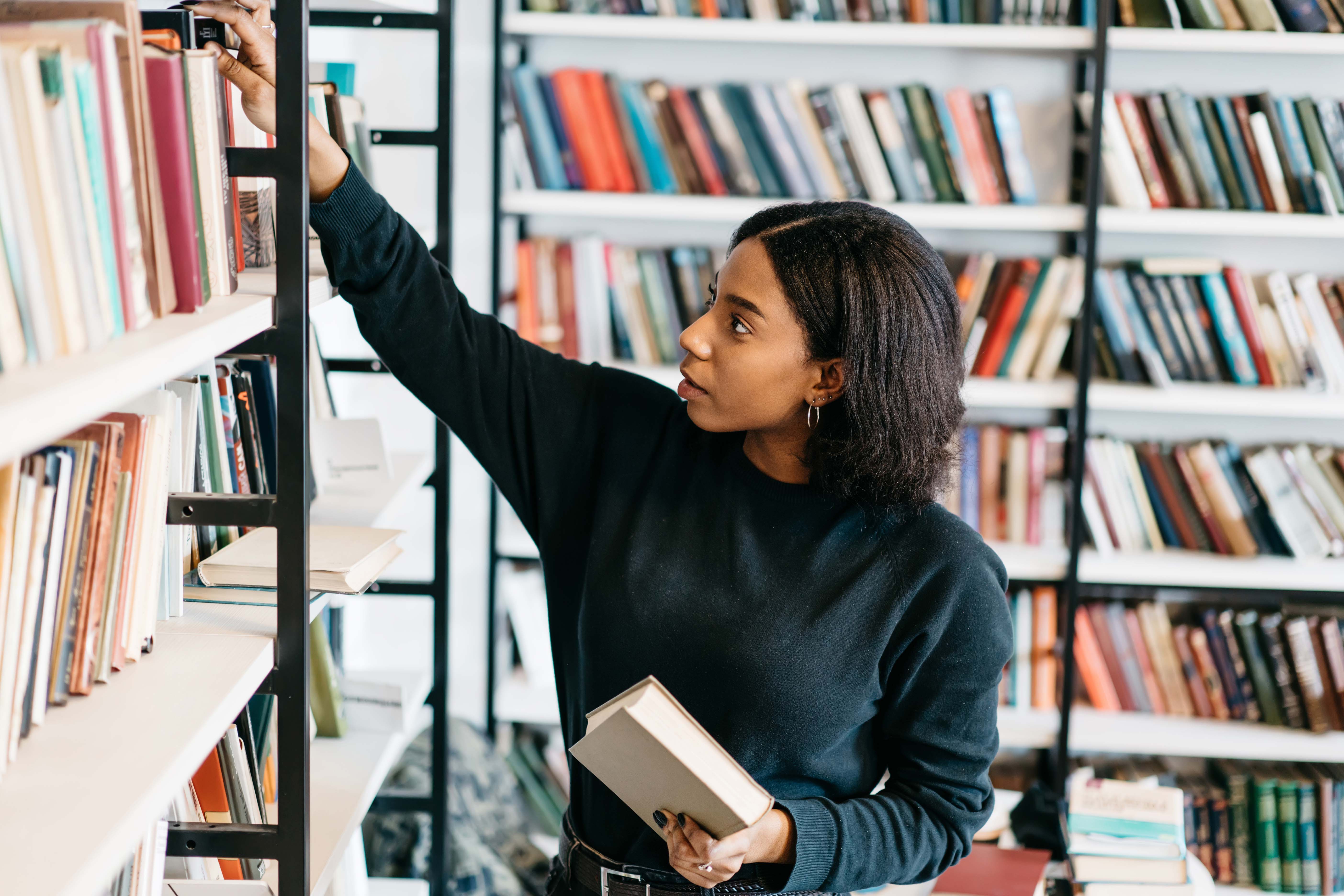 Libreria Aurelia  bookstore interior with shelves of books and visitors browsing.