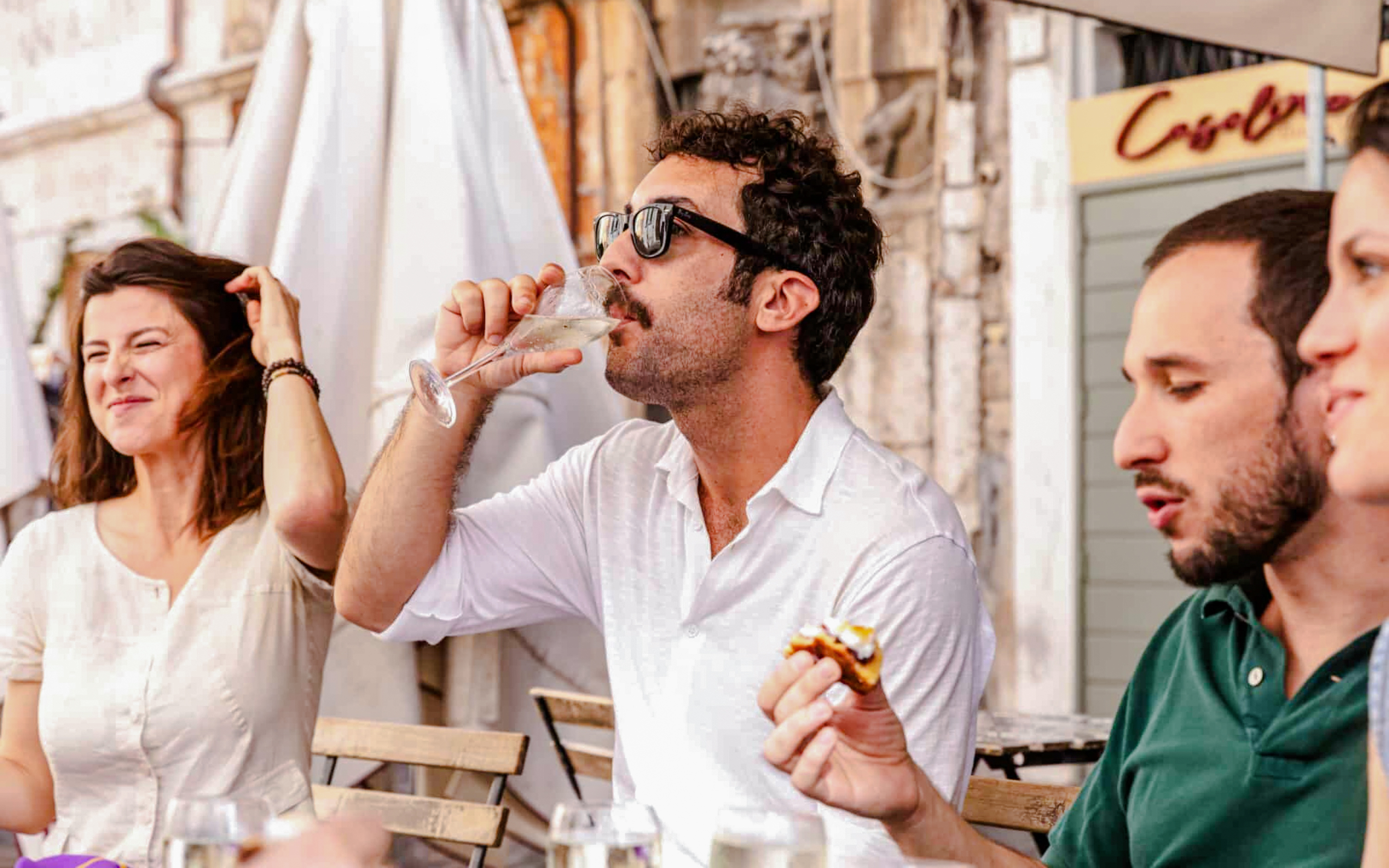 Group enjoying wine tasting on a Rome food tour.