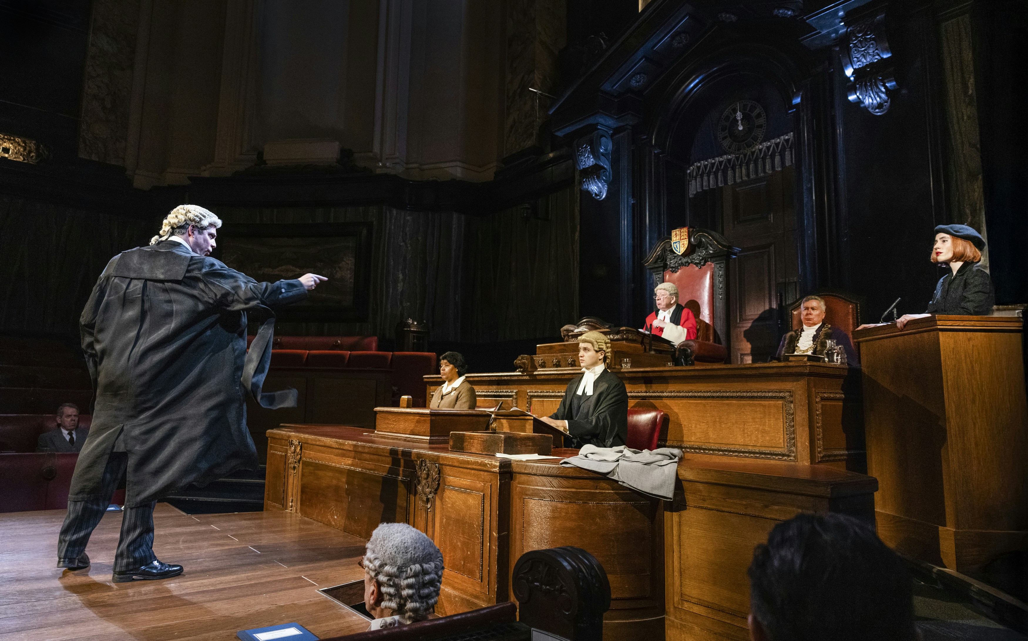 Courtroom scene from "Witness for the Prosecution" performance with actors in period costumes.