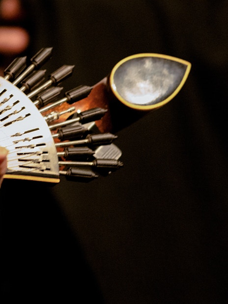 Fado guitarist playing traditional Portuguese guitar in Lisbon.