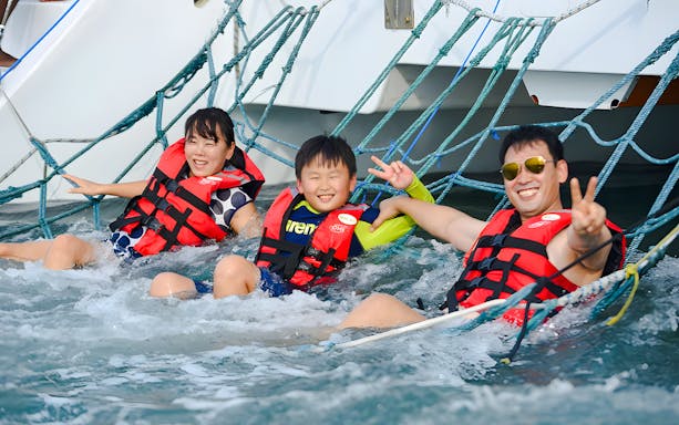 Family enjoying netting on Langkawi sunset cruise.