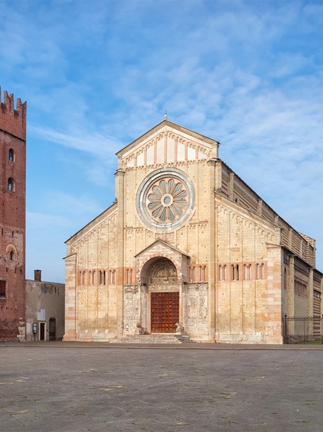 Basilica San Zeno Maggiore in Verona with its distinctive rose window and bell tower.