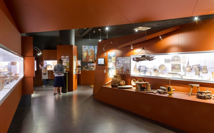 Interior exhibits of Chocolate Museum Paris showcasing historical chocolate-making tools.