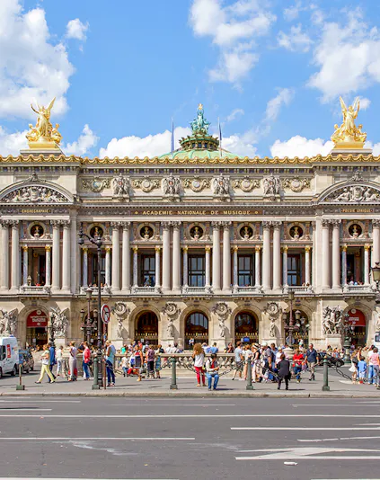 Opera Garnier facade with visitors in Paris, France.