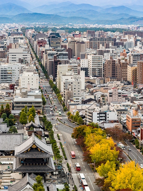 Kyoto cityscape view from Kyoto Tower with distant mountains.
