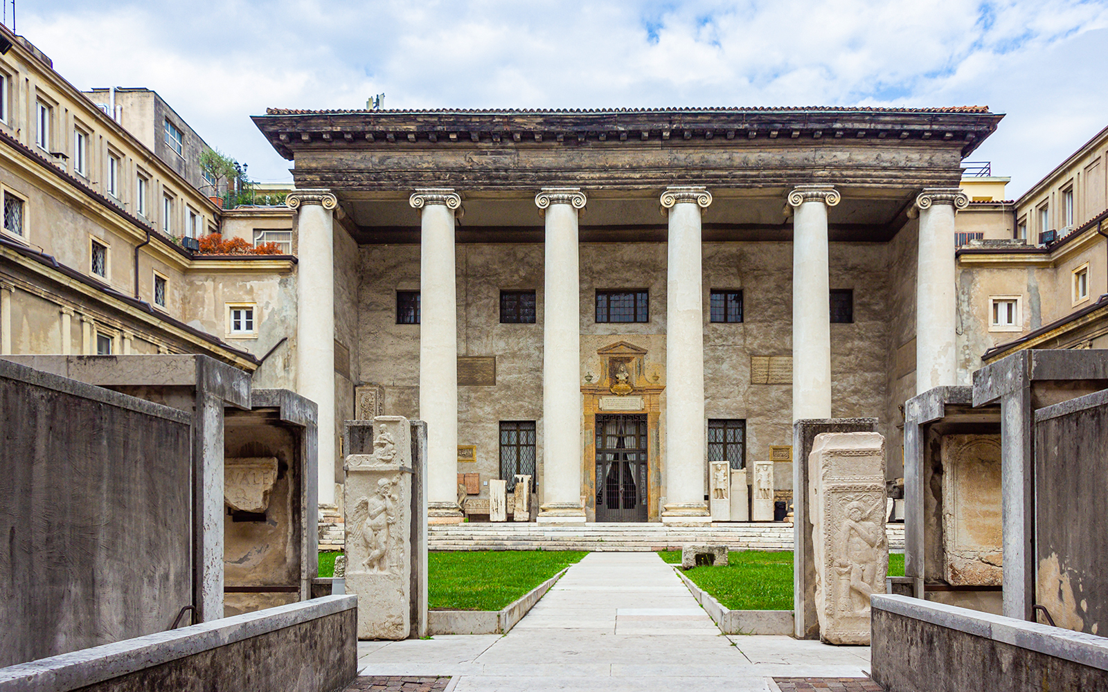 Verona archaeological museum entrance with ancient columns and stone carvings.