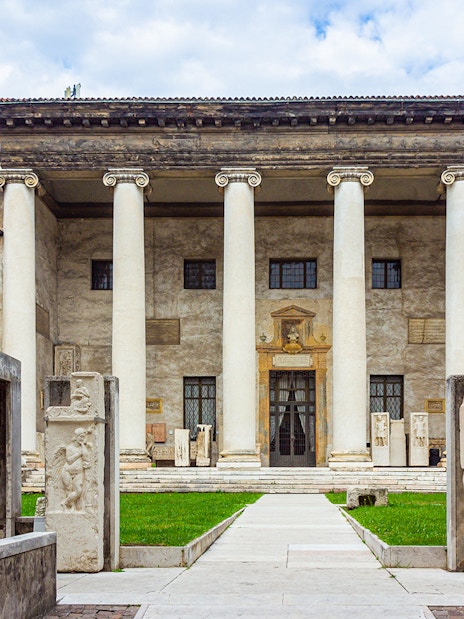 Verona archaeological museum entrance with ancient columns and stone carvings.