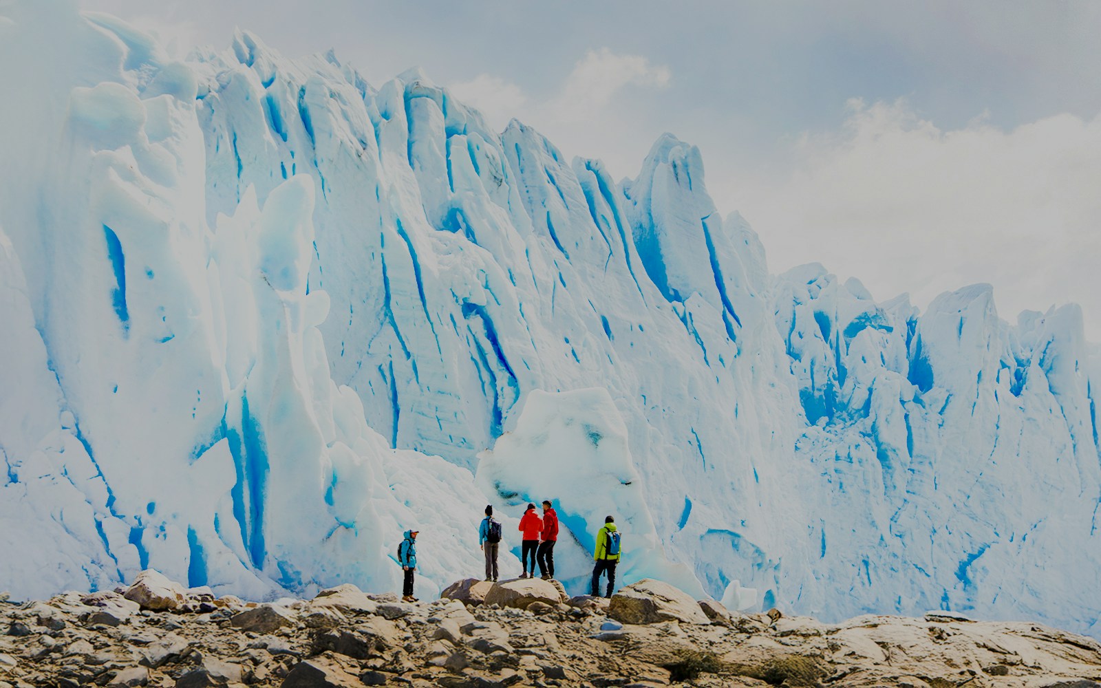 Tourists with guide hiking near Perito Moreno Glacier, Argentina.