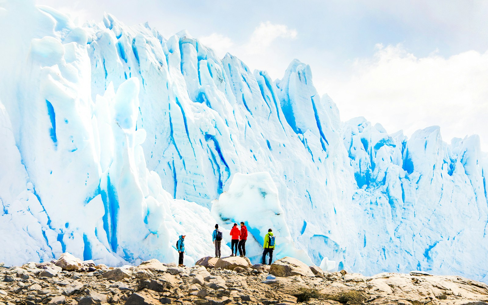 Tourists with guide hiking near Perito Moreno Glacier, Argentina.
