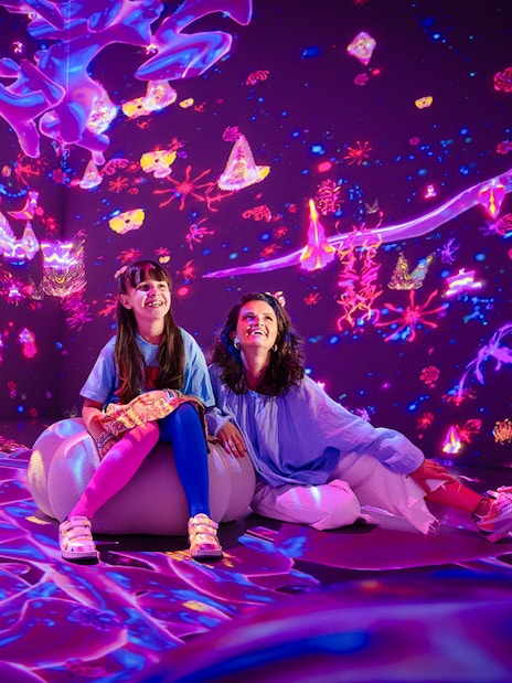 Tourists enjoying immersive digital art at House of Hype, Dubai.