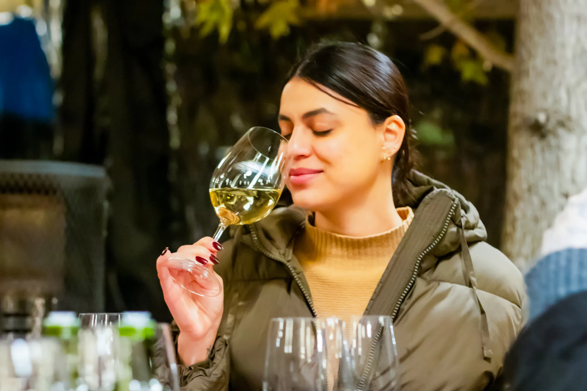 Woman enjoying wine tasting at Concha y Toro Winery, Santiago.