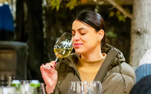 Woman enjoying wine tasting at Concha y Toro Winery, Santiago.