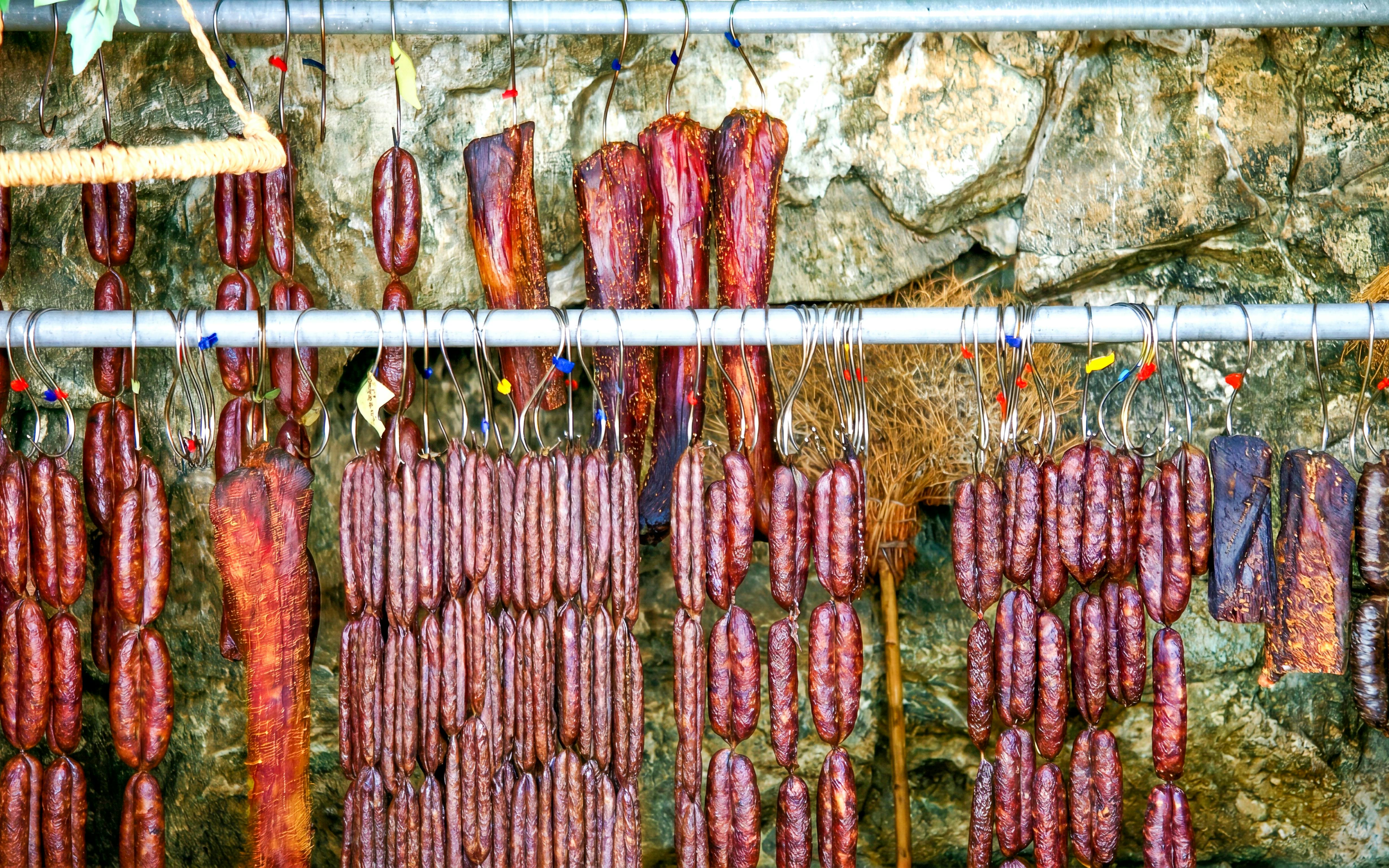 Hanging cured meats in Troodos Mountains, Cyprus, part of a gourmet tour from Limassol.