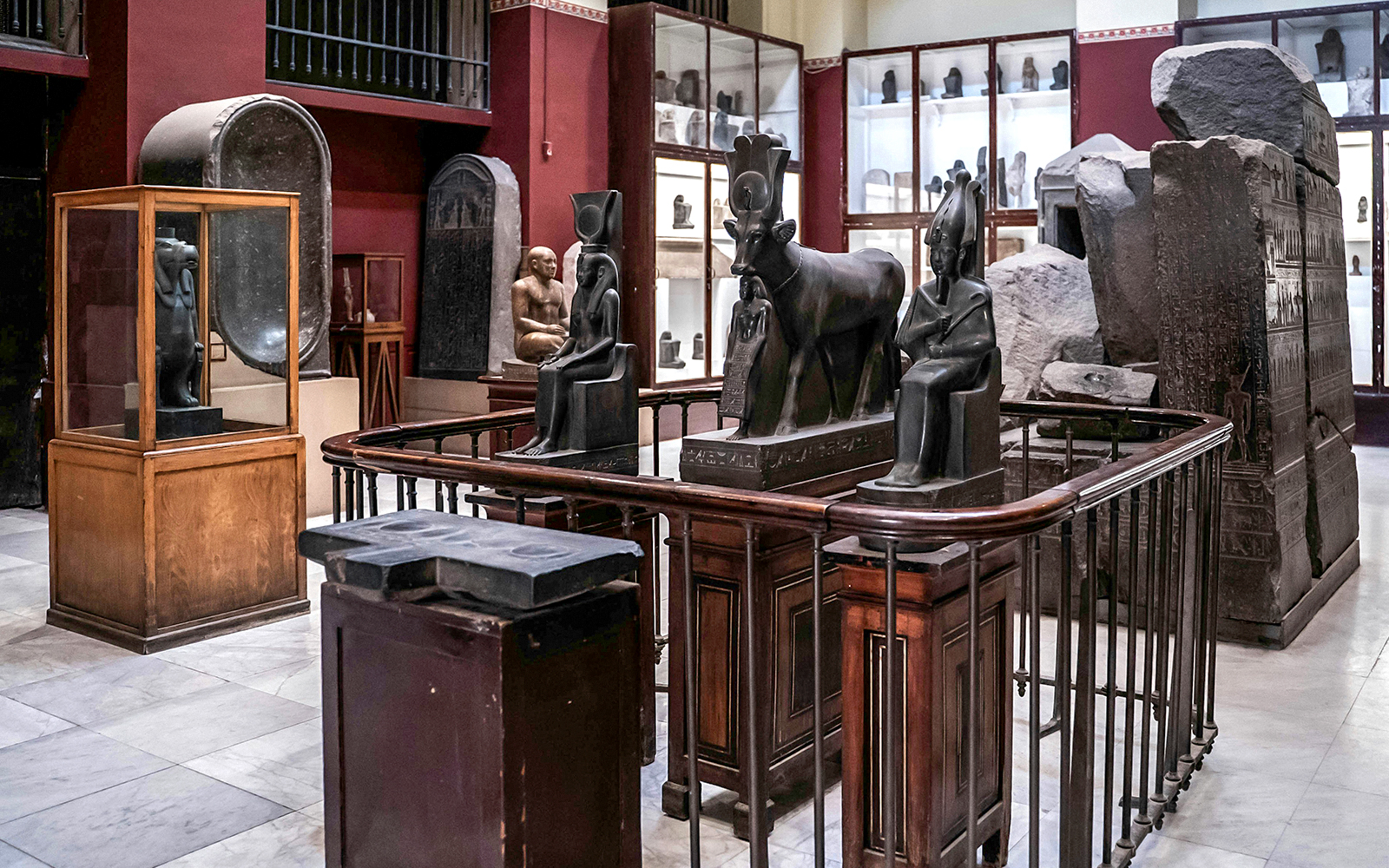 Ancient Egyptian statues and artifacts displayed in the Grand Egyptian Museum.