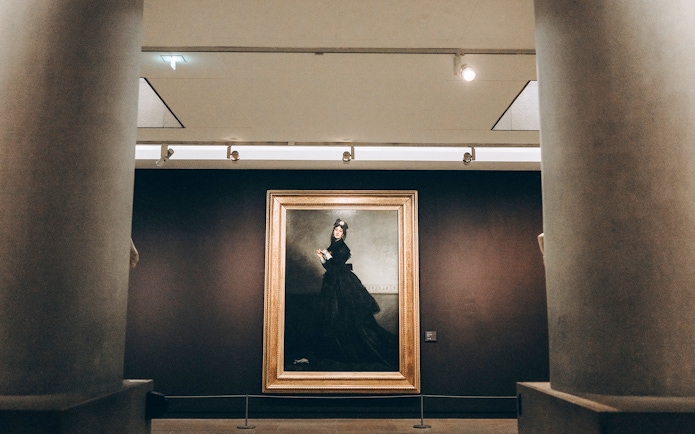Painting of a woman in black dress at Orsay Museum, Paris.