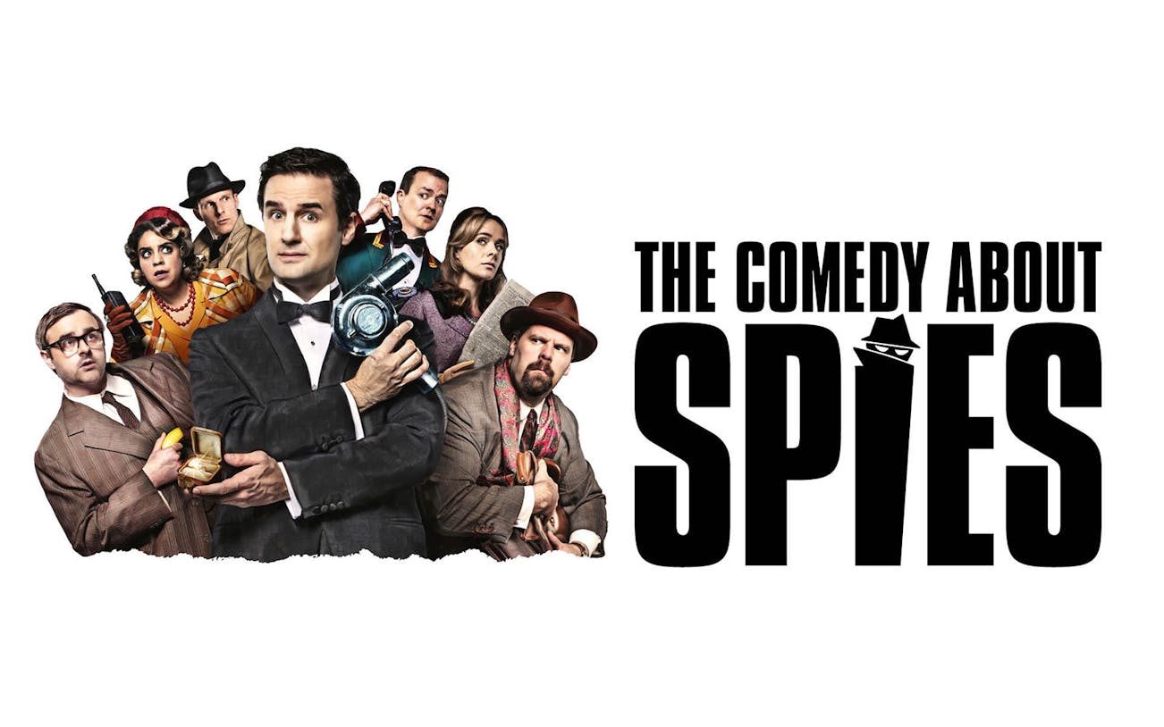 Characters in spy attire with "The Comedy About Spies" text.