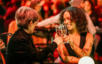Guests toasting at NGV Friday Nights, Cartier Exhibition, National Gallery Victoria.