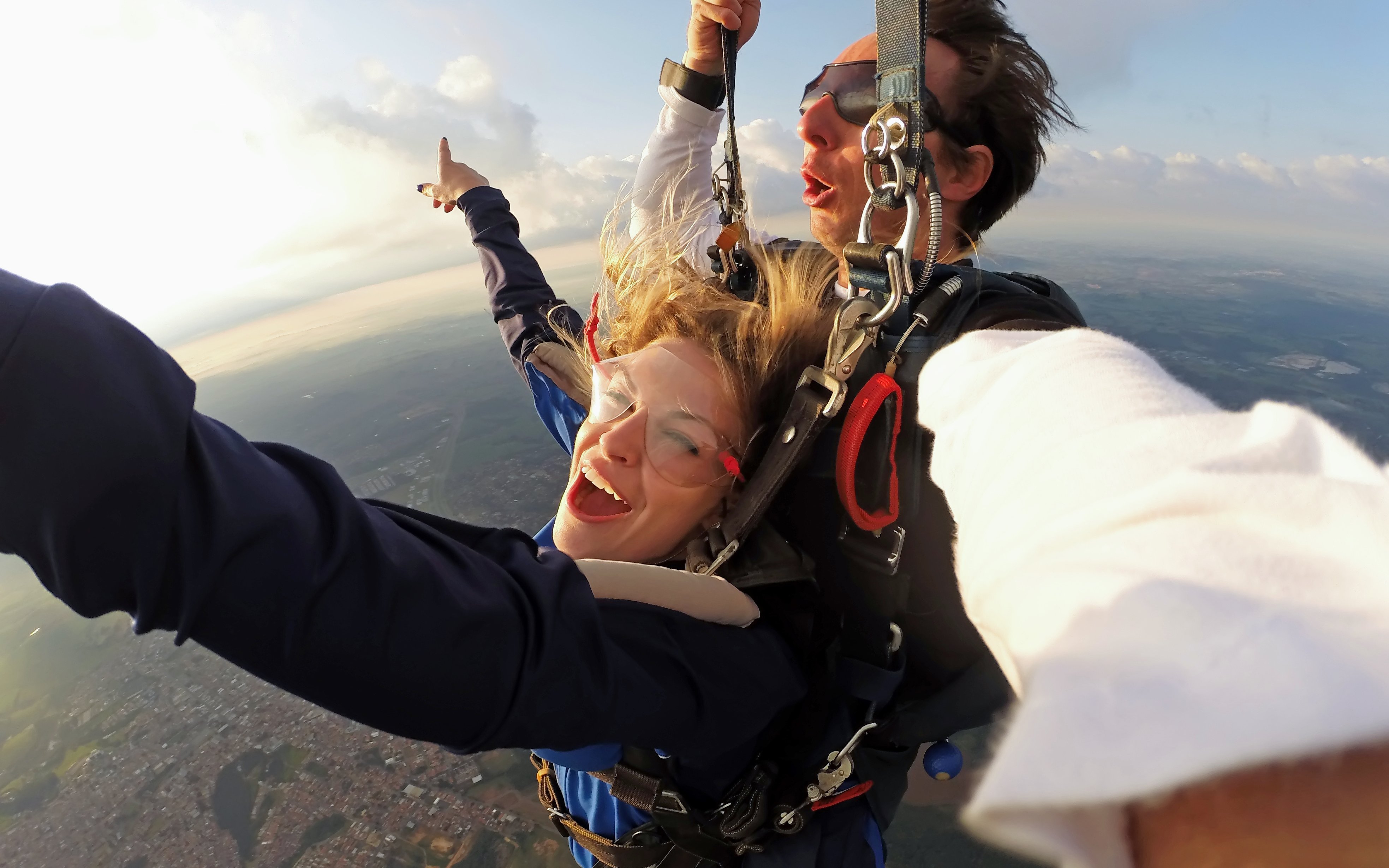 Paragliding tandem flight over Interlaken with scenic aerial view.