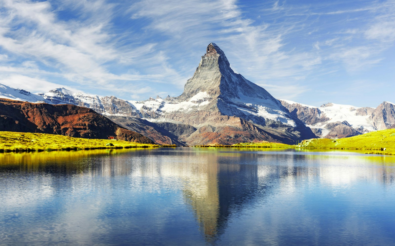 Picturesque view of Matterhorn Cervino peak and Stellisee lake in Swiss Alps.