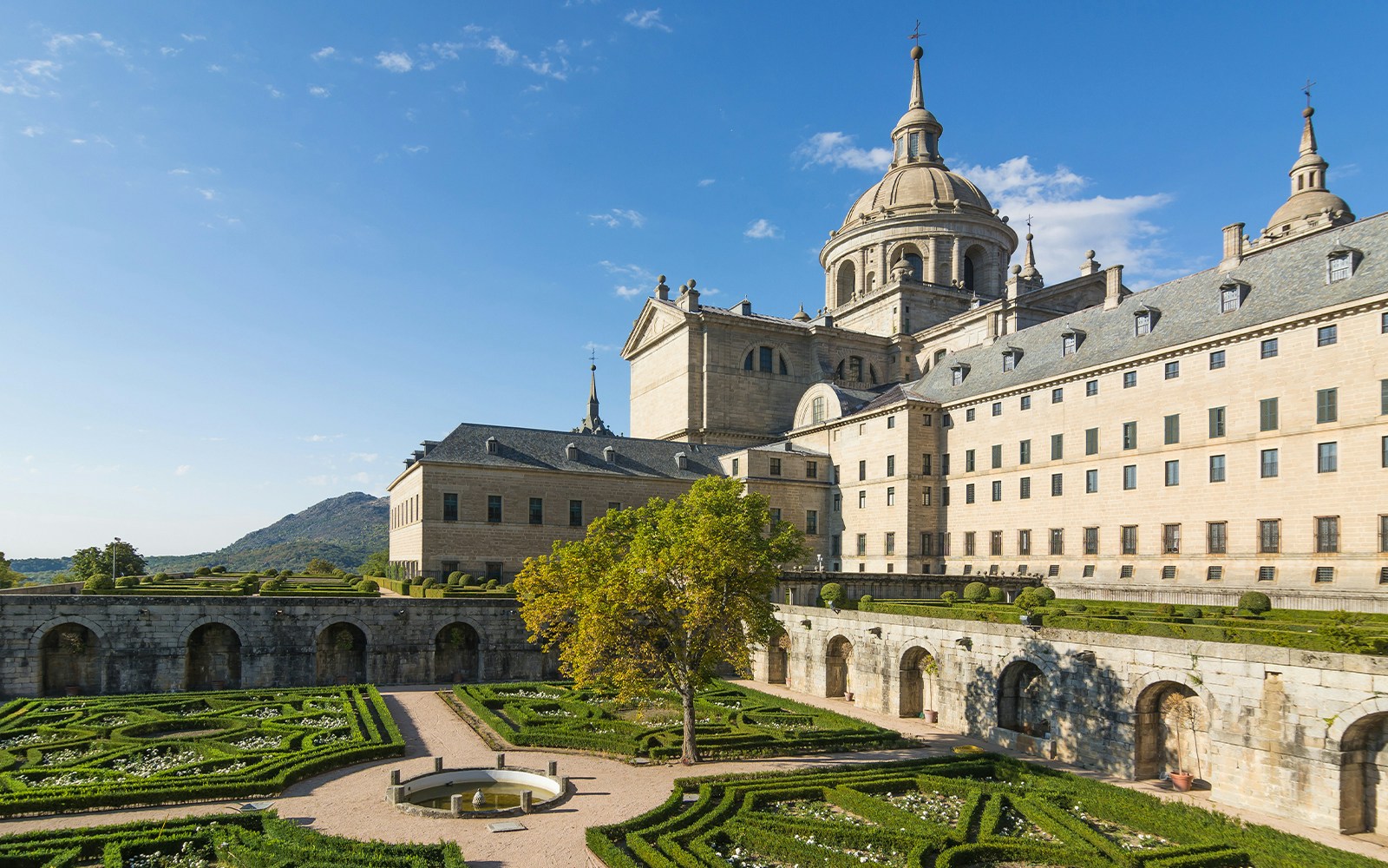 Royal Site of San Lorenzo de El Escorial courtyard and garden view in Madrid, Spain.