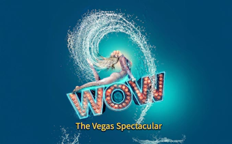 Performer in mid-air pose with water splash, "WOW" sign, Vegas show.