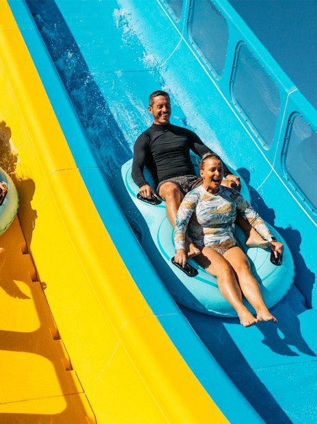 Tourists sliding down water slides at Kaboom, Wet n Wild.
