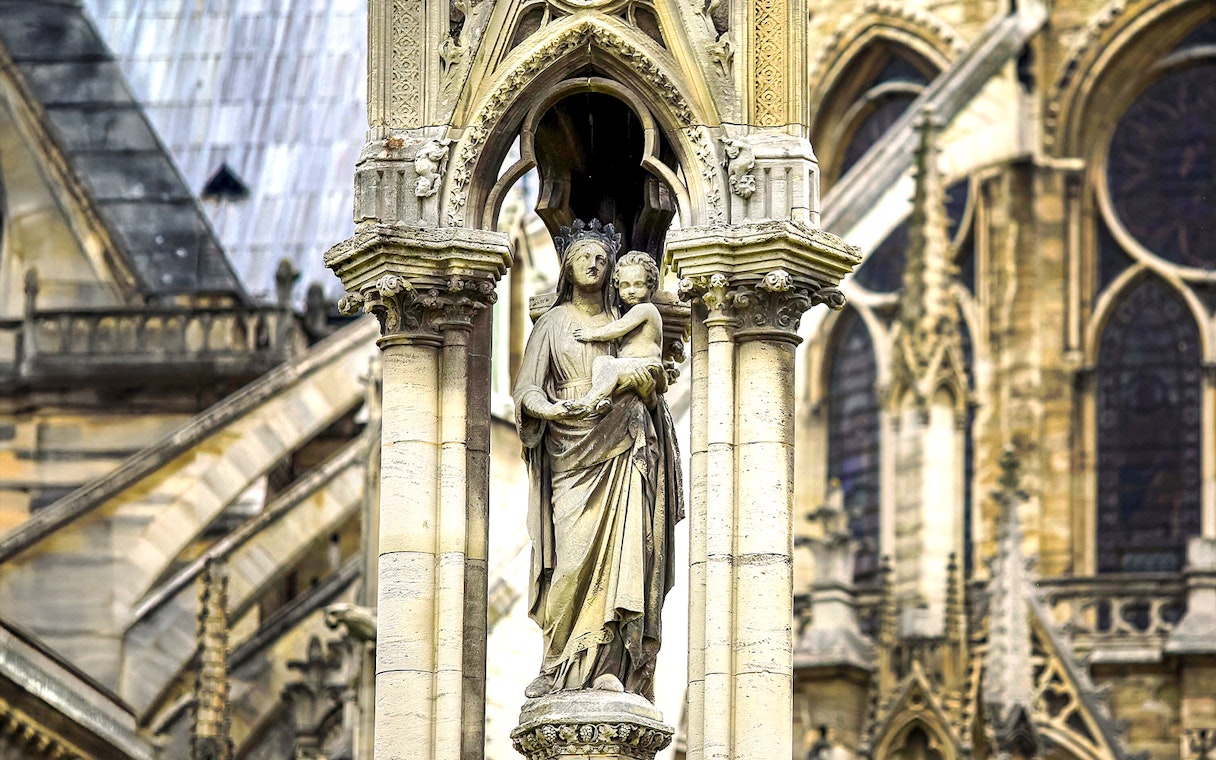 Notre-Dame Cathedral statue detail, Paris tour with audio guide.