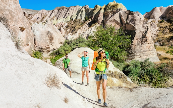 Guests hiking through Love Valley's unique rock formations in Cappadocia.