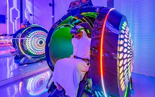 Person experiencing virtual reality at Pixoul Gaming, Abu Dhabi.