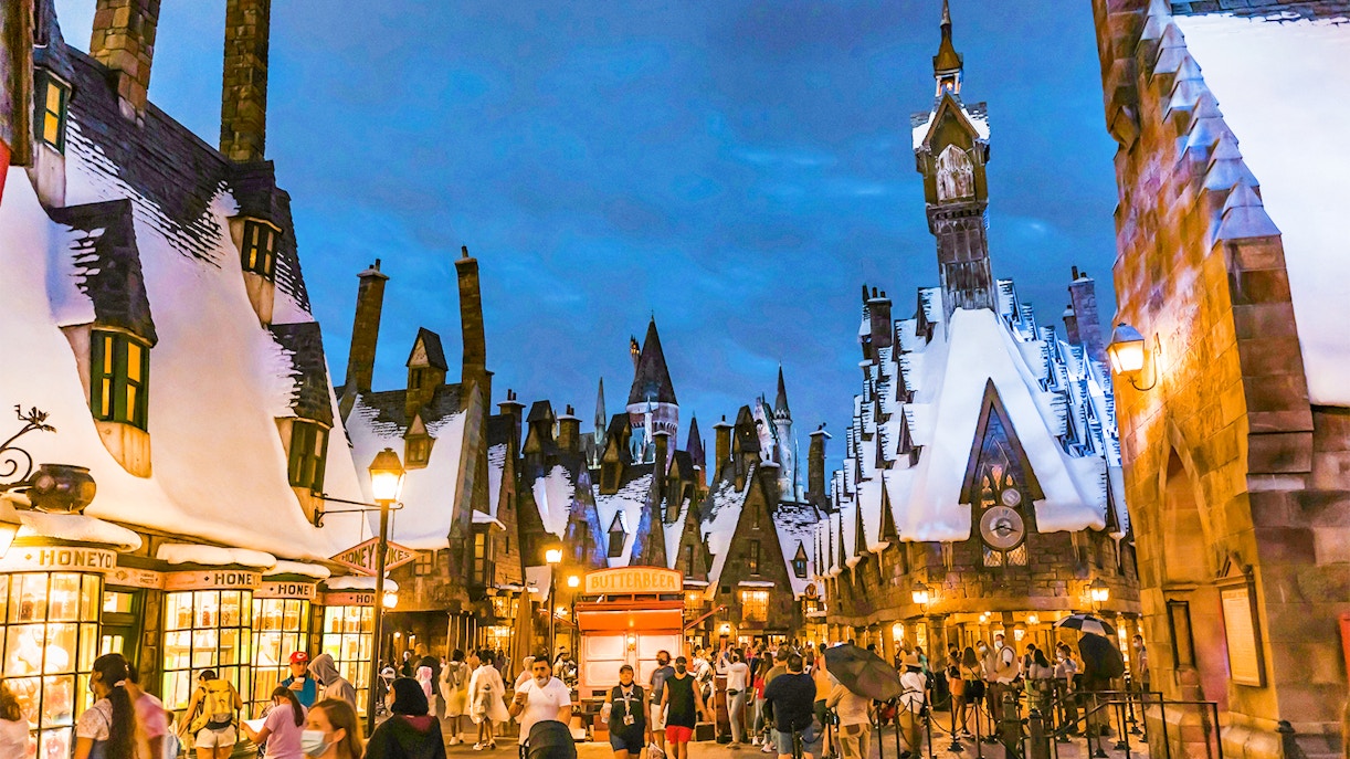 Hogsmeade village with snow-covered rooftops at Universal Orlando's Winter Magic event.
