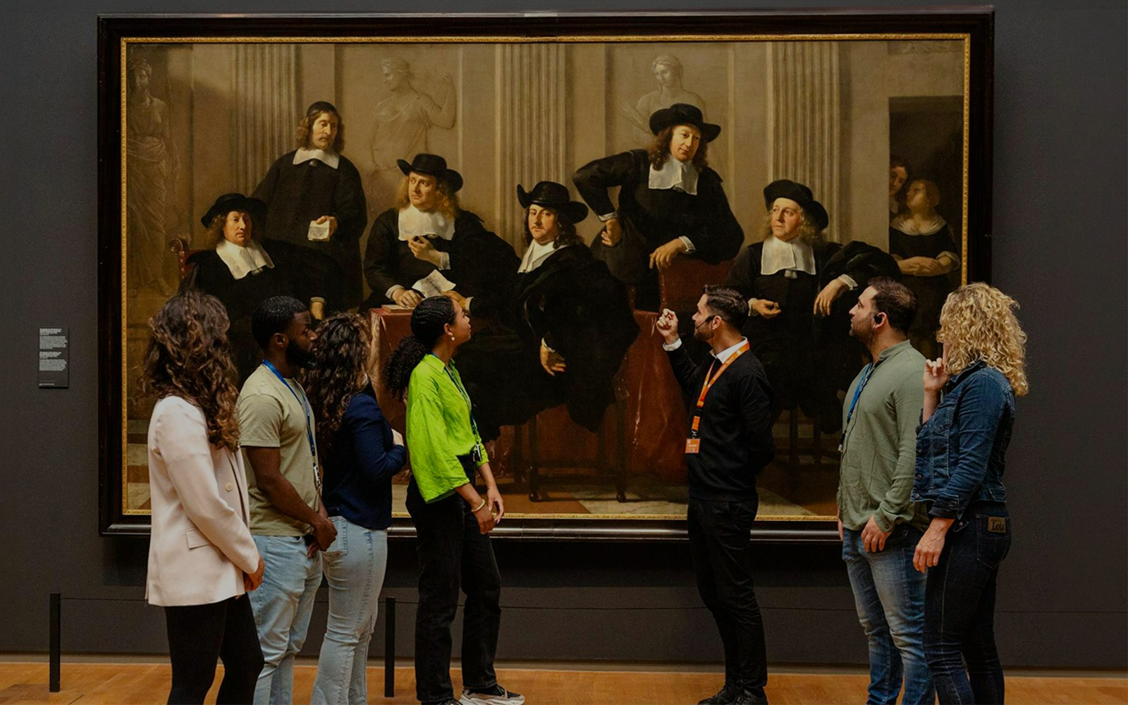 Visitors viewing Rembrandt's "The Sampling Officials" at the Rijksmuseum, Amsterdam.