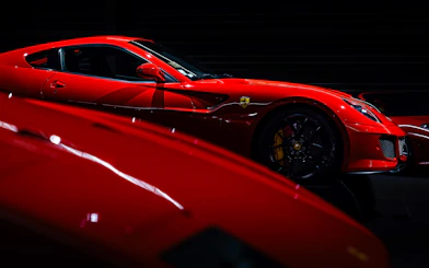 Red sports car on display at Coligny Car Museum, Lyon, France.