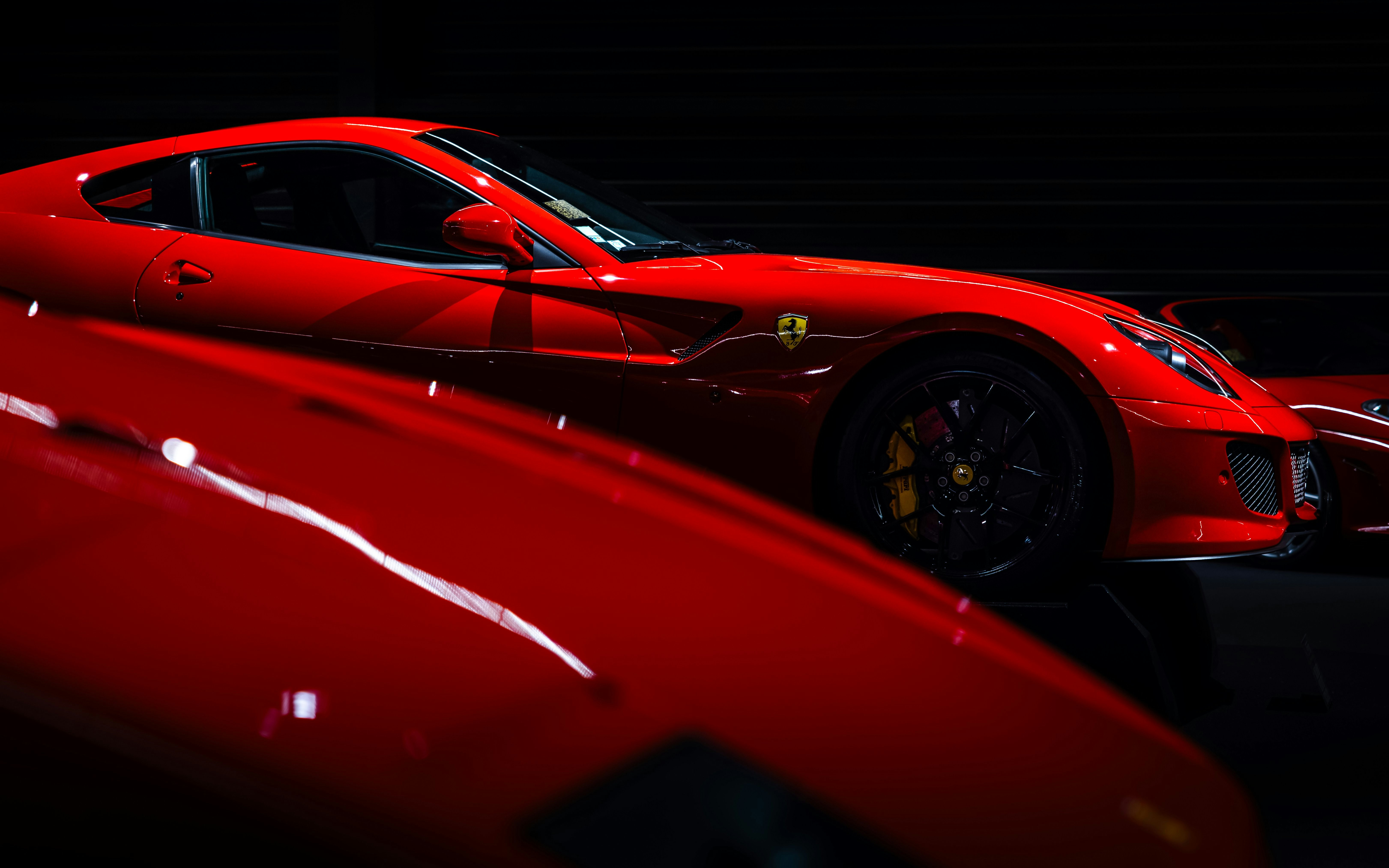 Red sports car on display at Coligny Car Museum, Lyon, France.