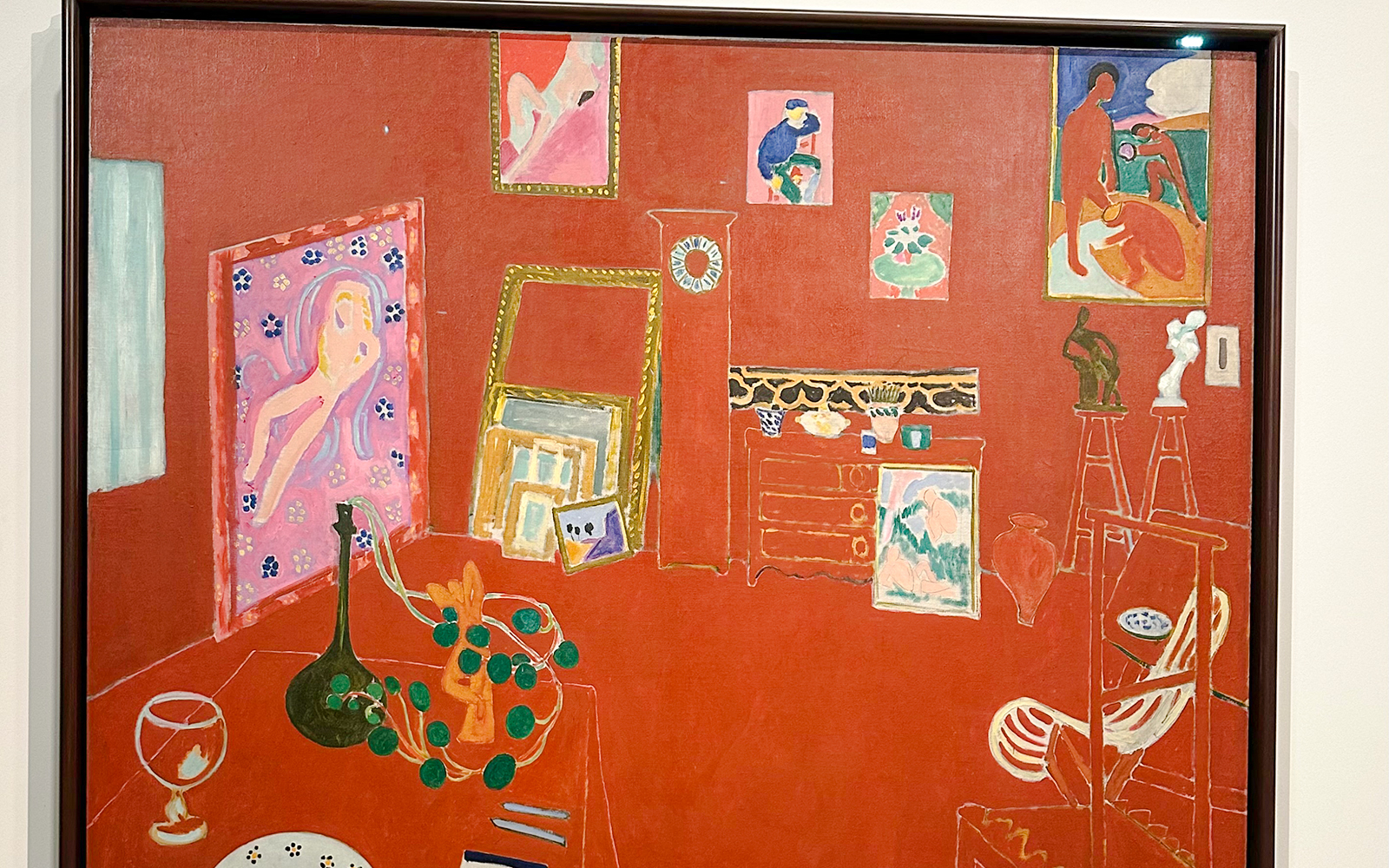 Interior with red walls and various artworks, Fondation Louis Vuitton, Napoleonic stereotype by Basquiat.